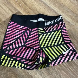 Women’s nike pro 3 inch pink and yellow pattern athletic shorts